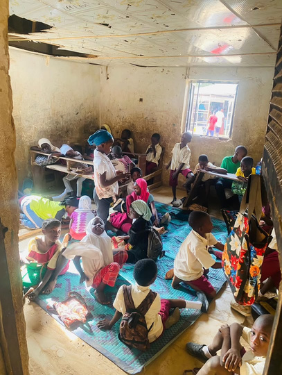 Children sitting on mats before the Nesesitiz Kids intervention
