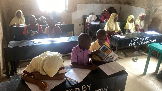 Children using EFSTA donated furniture in the classroom